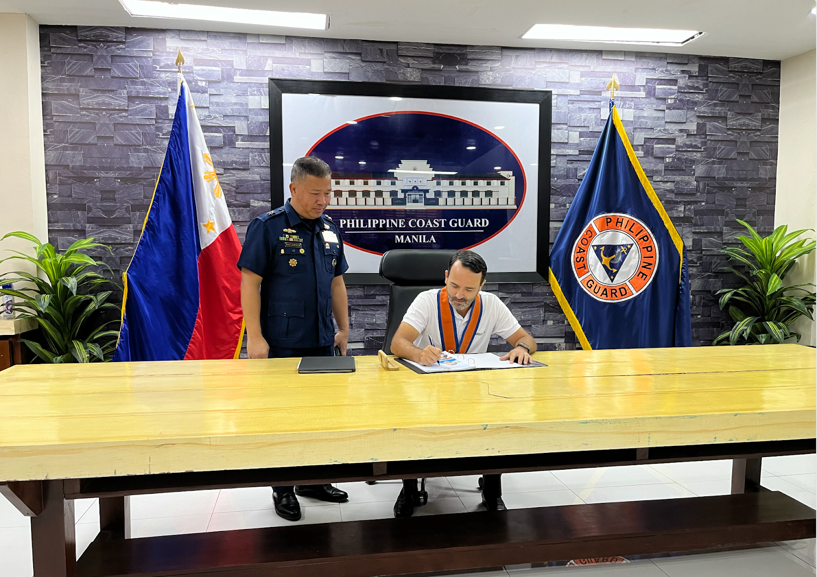 Aboitiz Foods President and CEO, Tristan Aboitiz, signs the Memorandum of Understanding (MoU) alongside Philippine Coast Guard Commandant, Admiral Ronnie Gil Gavan PCG